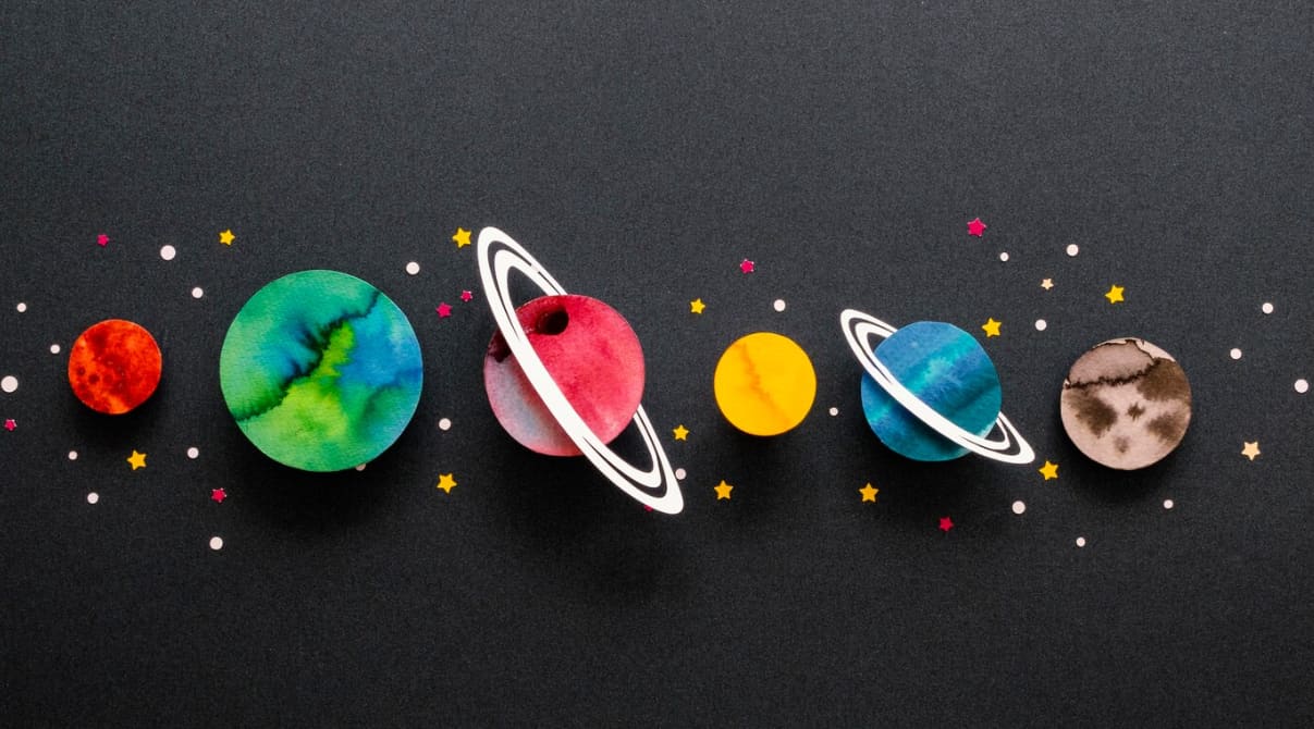 Planets depicted as colorful circular cutouts with stars on a black backdrop
