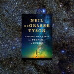 A book on astrophysics against the backdrop of a starry sky